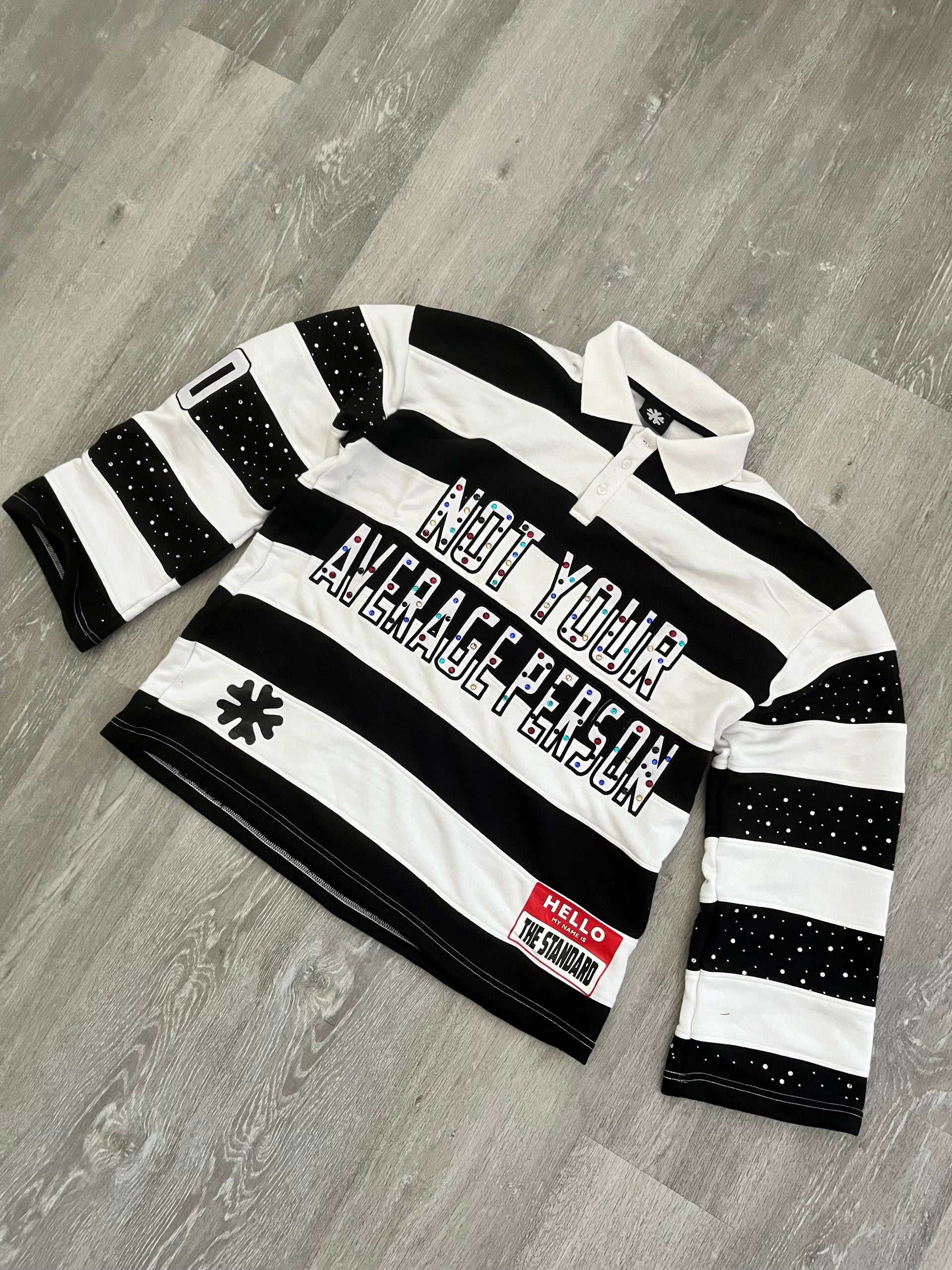 Black "NOT YOUR AVRAGE PERSON" Polo